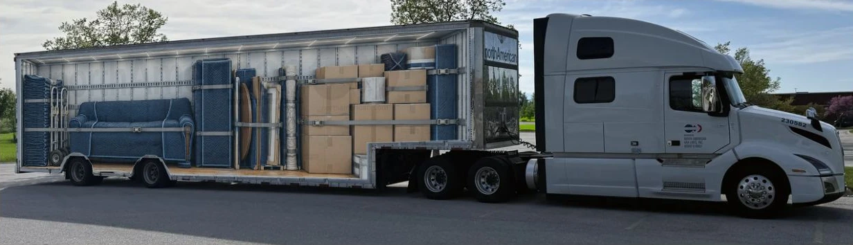 Fully revealed Humboldt truck cutaway showing padded furniture, cartons, dollies and secured belongings.